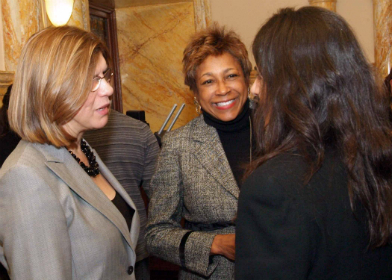 Senators Nellie Pou, D-Passaic and Bergen, and Sandra Bolden Cunningham, D-Hudson, speak to a visitor in the Senate chambers before the start of the Reorganization ceremony.