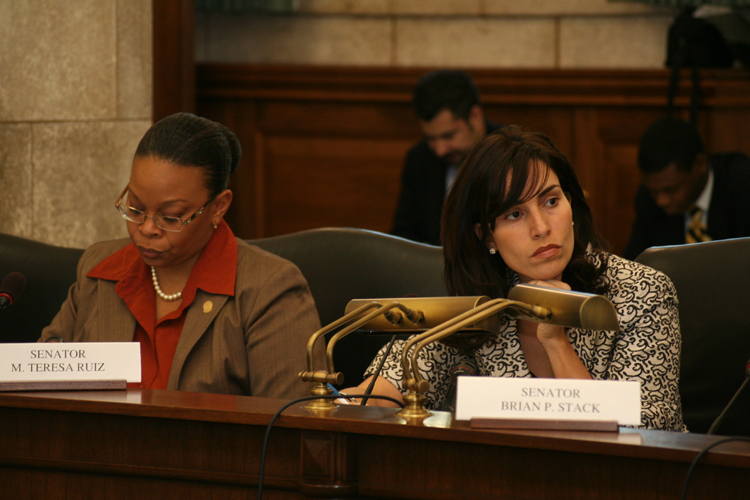 Senators Dana Redd, D-Camden and Gloucester (left) and Teresa Ruiz, D-Essex and Union, listens to testimony at the Senate Budget Committee meeting on Governor Corzine's toll road plan.