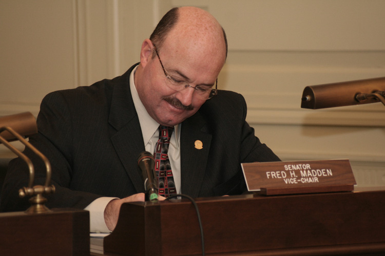 Senator Fred Madden listens to testimony during the Senate Transportation Committee hearing.