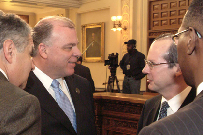 Senate President Steve Sweeney, D-Gloucester, Cumberland and Salem speaks with New Jersey Supreme Court Chief Justice Stuart Rabner before Governor Christie's address on mid-year budget solutions.
