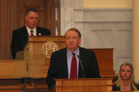 Governor and Senate President Richard J. Codey, D-Essex, issues his budget address for Fiscal Year 2006 to a joint session of the State Legislature in the Assembly chambers.  Assembly Speaker Albio Sires stands behind him at the dais.