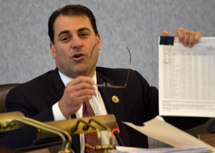 Senator Paul A. Sarlo, D-Bergen and Passaic, the Chair of the Senate Budget and Appropriations Committee, holds up a copy of the FY 2012 Budget during the Committee’s first hearing to scrutinize the Governor’s proposed fiscal plan.