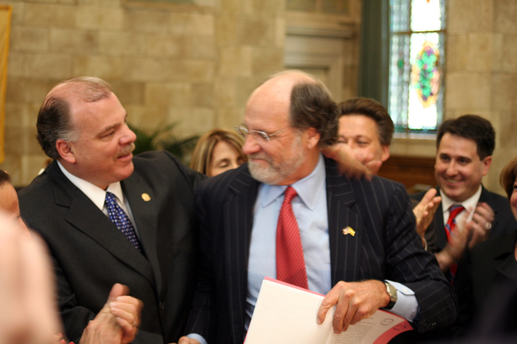 Senate Majority Leader Steve Sweeney, D-Gloucester, shakes hands with Governor Corzine at the bill signing ceremony for S-786, which he sponsored with Senate Budget Committee Chair Barbara Buono, D-Middlesex, to offer temporary paid family leave for New Jersey’s workers.